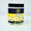 Premium-quality cashew nuts in a wooden bowl with a few scattered around, showcasing their rich, creamy texture and natural color