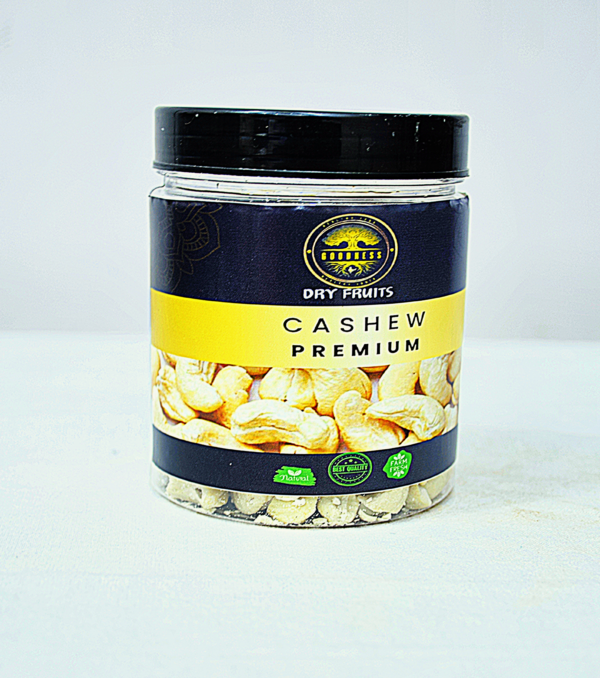 Premium-quality cashew nuts in a wooden bowl with a few scattered around, showcasing their rich, creamy texture and natural color